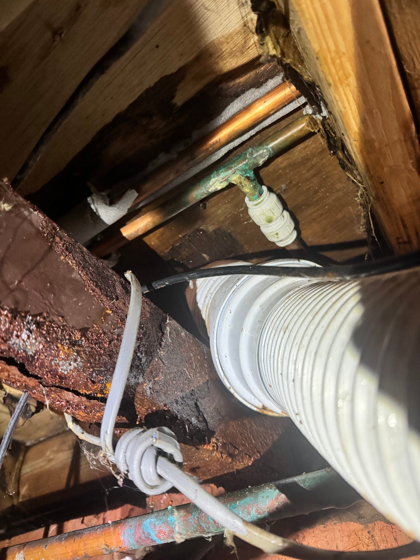 Inspection camera view beneath floor — pipe inspection during leak detection survey
